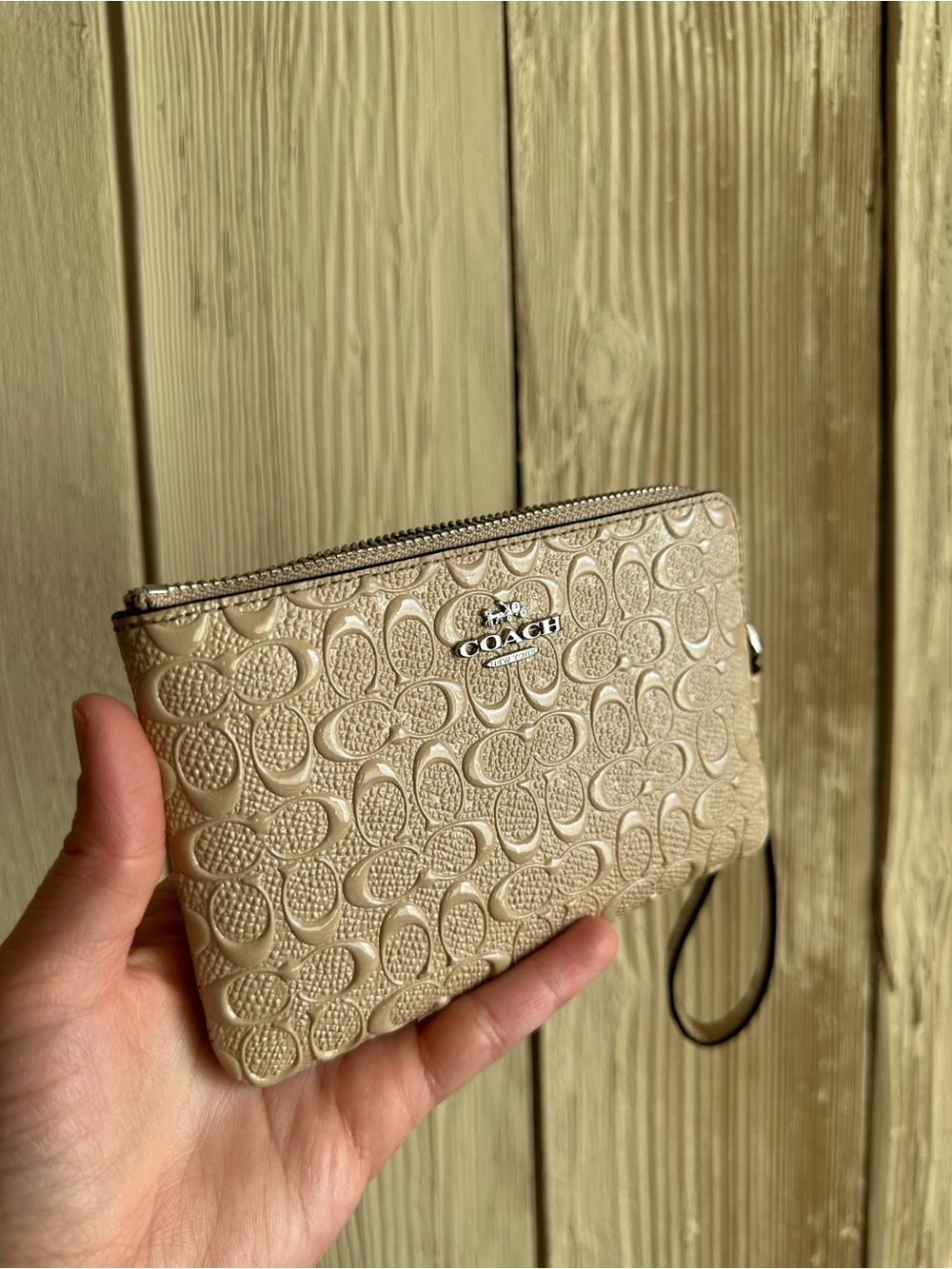 Coach Beige Embossed Signature Wristlet Pouch